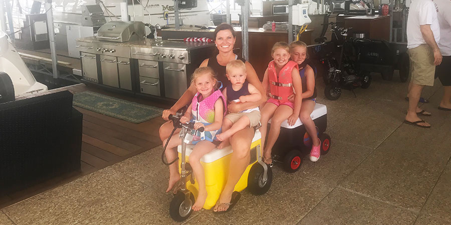 Family riding ice chest train.